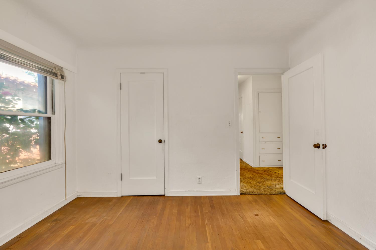 500 North G Street Madera, CA 93637 - Photo 16 of 24 a view of an empty room with wooden floor and a window
