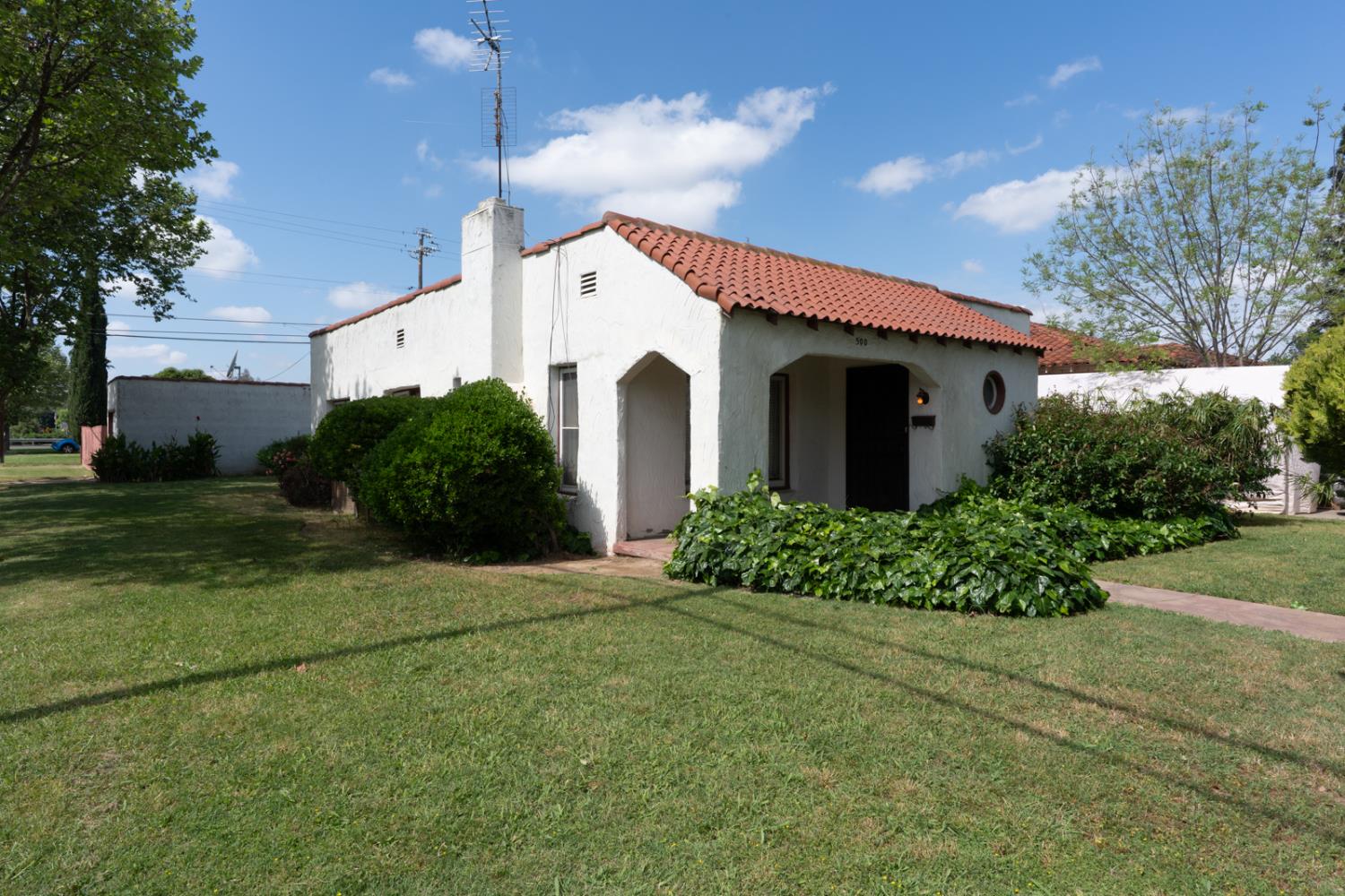 500 North G Street Madera, CA 93637 - Photo 2 of 24 a view of a house with a yard