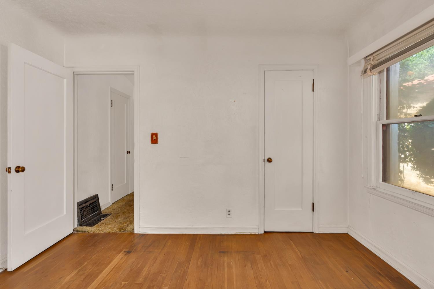 500 North G Street Madera, CA 93637 - Photo 22 of 24 a view of an empty room with wooden floor and a window