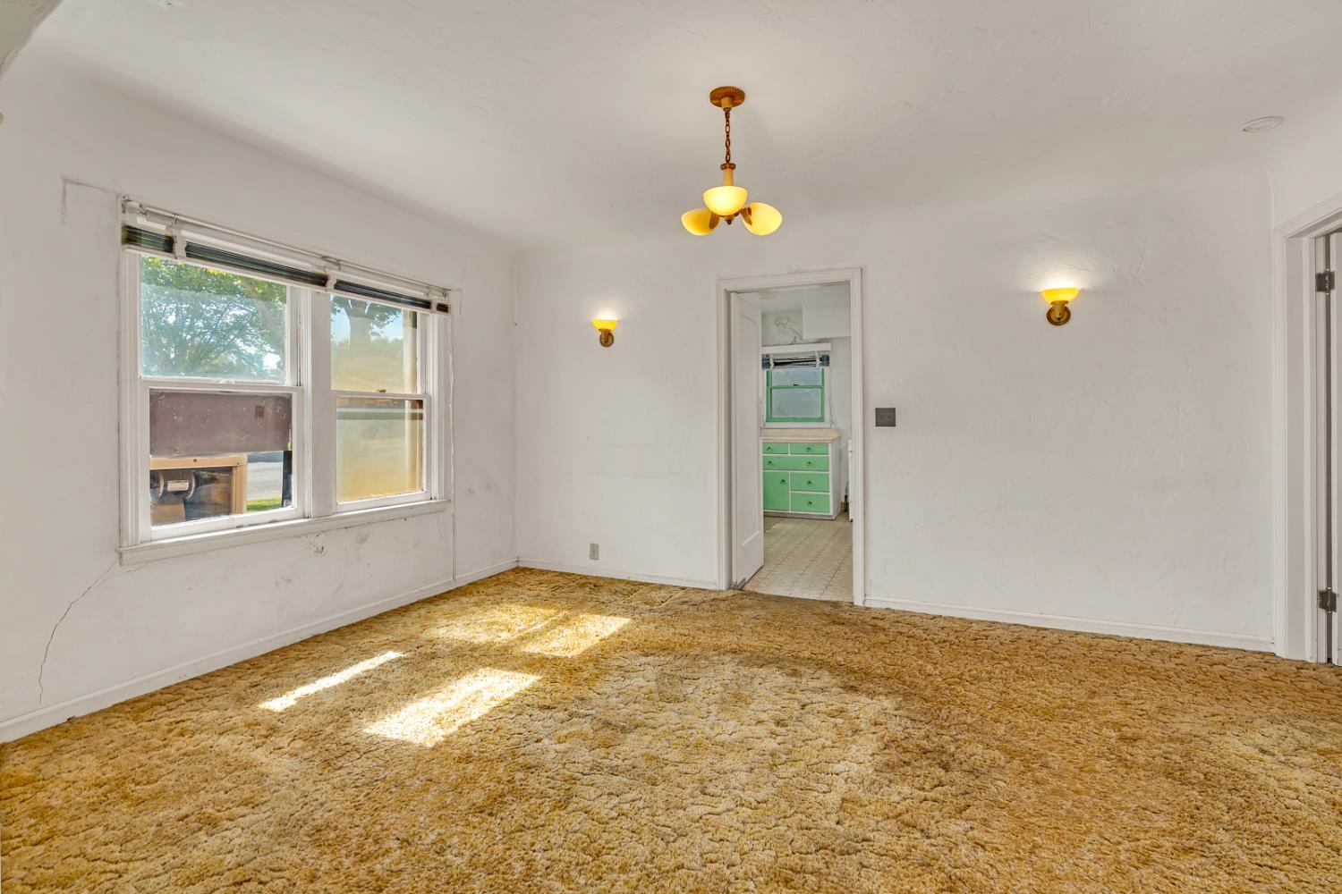 500 North G Street Madera, CA 93637 - Photo 5 of 24 a view of an empty room with a window