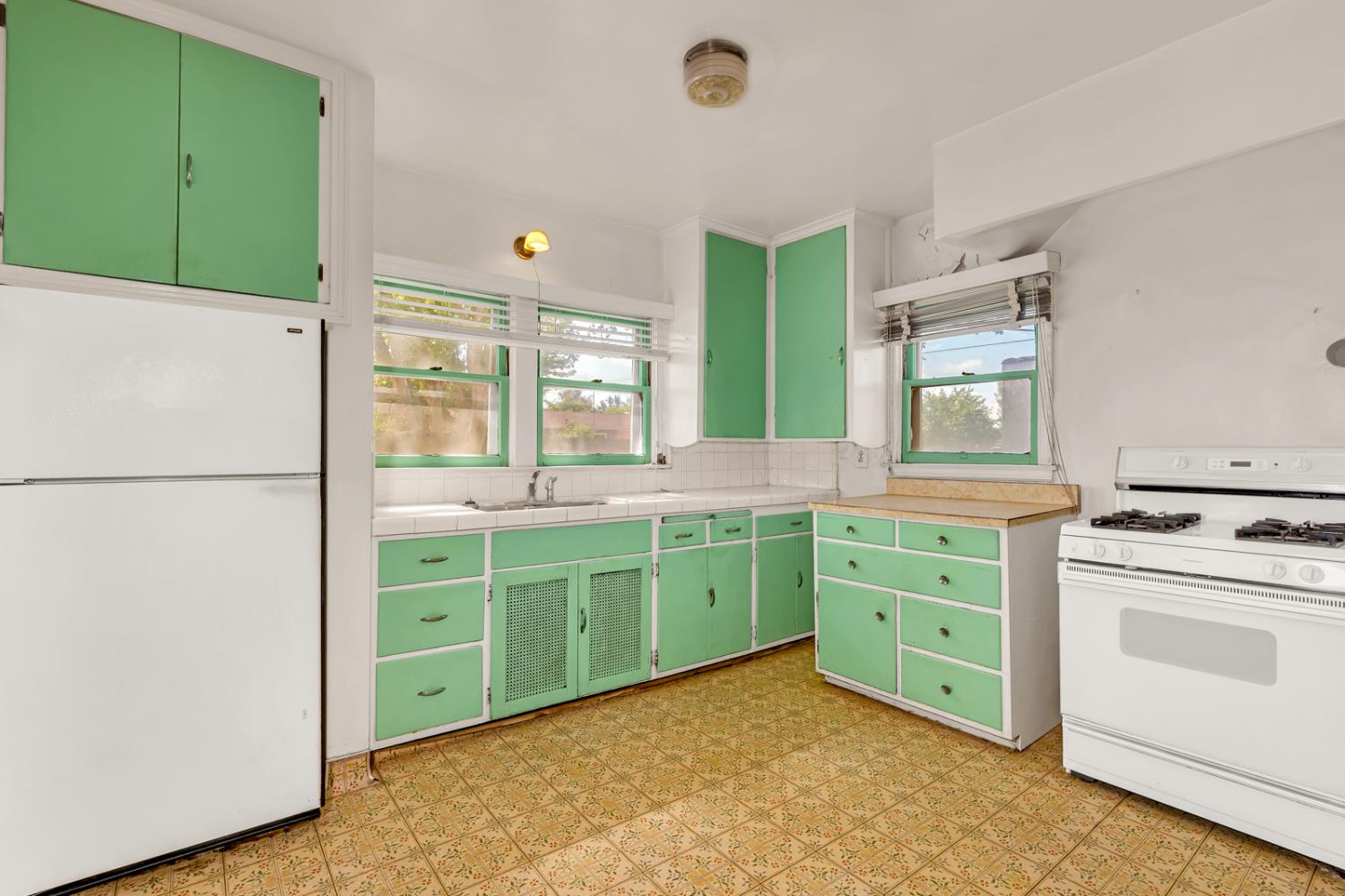 500 North G Street Madera, CA 93637 - Photo 10 of 24 a kitchen with cabinets appliances and a counter top space