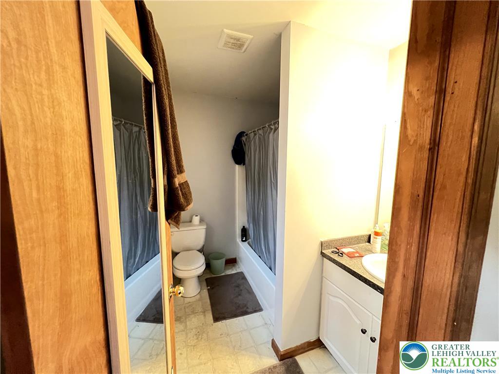 107 Warbler Court Bushkill, PA 18324 - Photo 16 of 32 a bathroom with a toilet and a shower