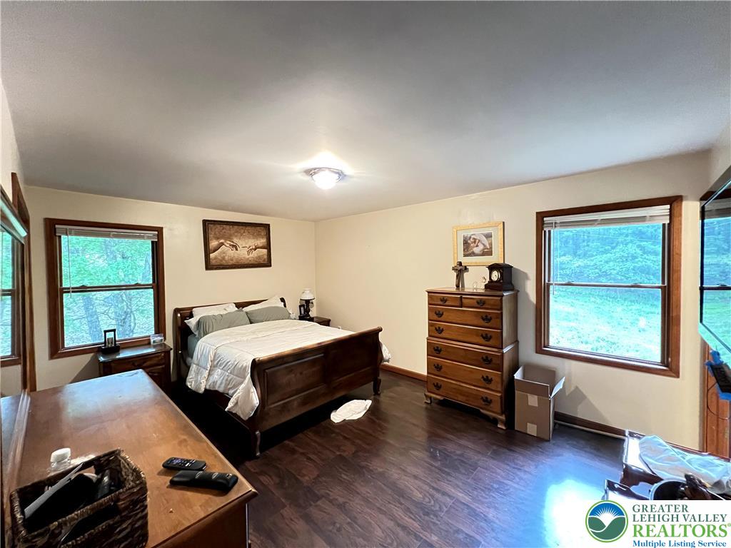 107 Warbler Court Bushkill, PA 18324 - Photo 19 of 32 a bedroom with a bed and a window