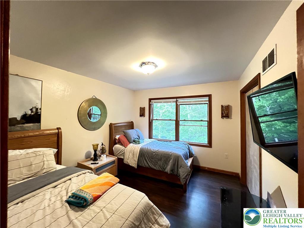 107 Warbler Court Bushkill, PA 18324 - Photo 24 of 32 a bedroom with two beds and a large window