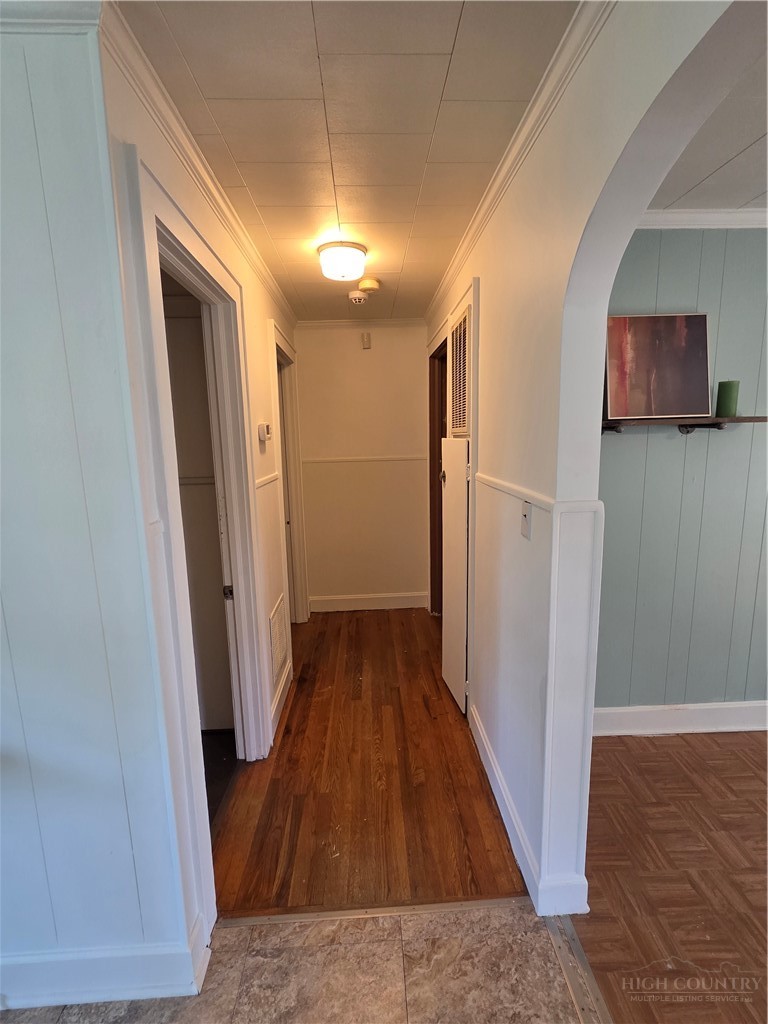 145 Black Oak Ridge Road Taylorsville, NC 28681 - Photo 22 of 39 a view of a hallway with wooden floor and staircase