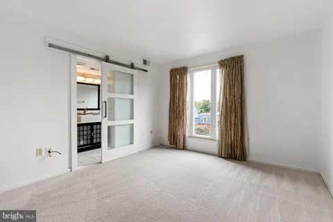 a view of a big room with windows and cabinet