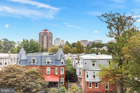 a view of a city with tall buildings