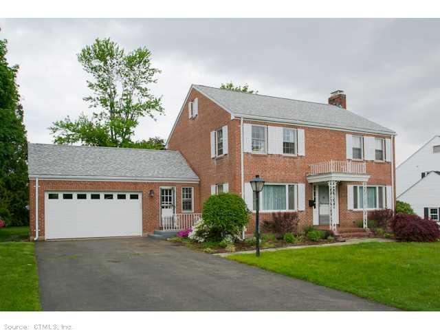 521 Brimfield Road Wethersfield, CT 06109 - Photo 1 of 1 a view of a yard in front of a house