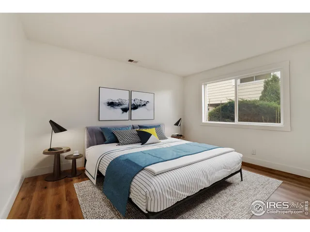 a bedroom with a bed and window