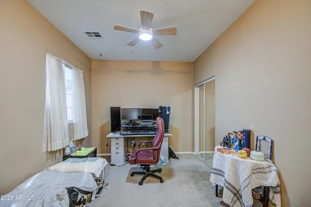 a bathroom with a sink mirror vanity and toilet