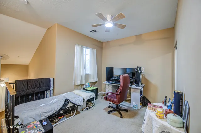 a view of a street with a building in the background