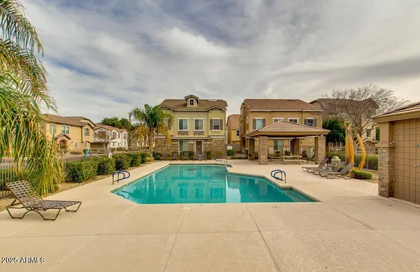 a view of multiple houses with yard
