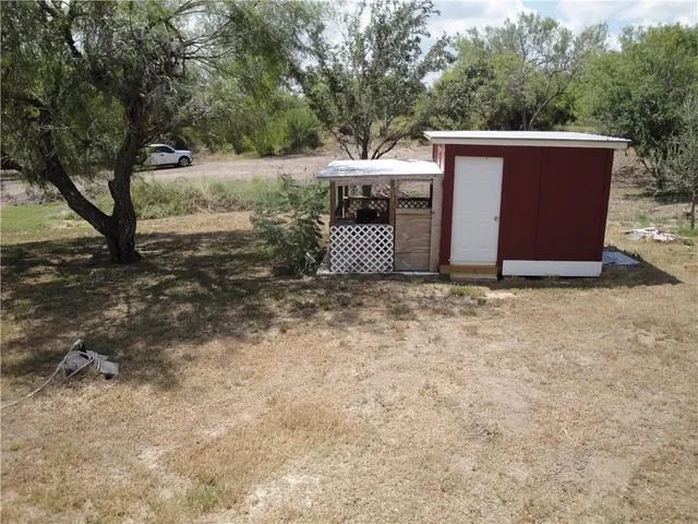 a view of a trees in the backyard