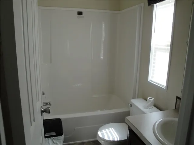 a bathroom with a sink and toilet