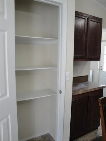 a kitchen with a sink and a refrigerator