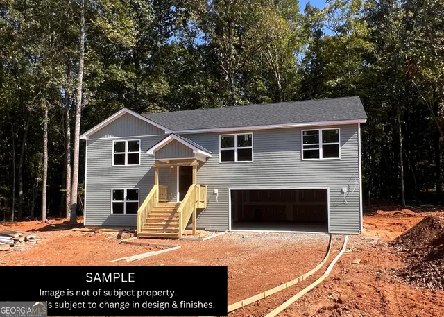 a view of a house with backyard and porch