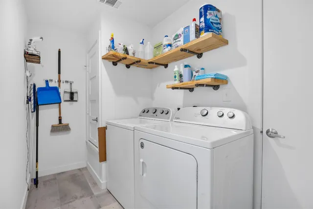 a utility room with dryer and washer