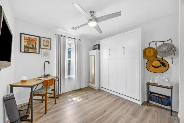 a view of room with furniture and wooden floor