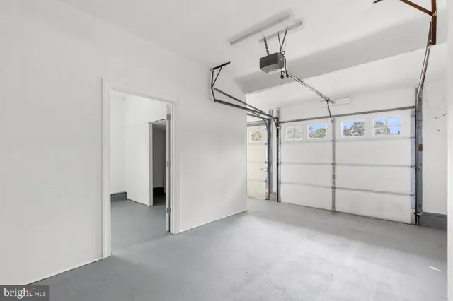 a view of room with window and hardwood floor