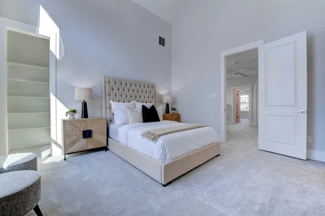 a bed room with a bed and a chair