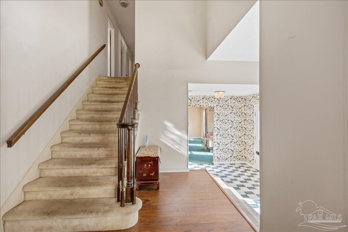 5560 Willard Norris Road Milton, FL 32570 - Photo 14 of 58 a view of entryway and hall with wooden floor