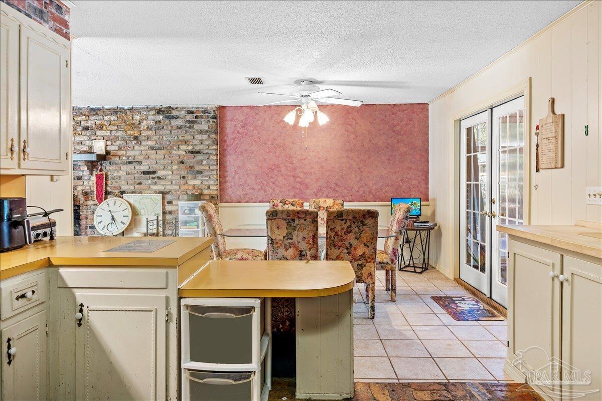 5560 Willard Norris Road Milton, FL 32570 - Photo 35 of 58 a spacious bathroom with a sink mirror and shower