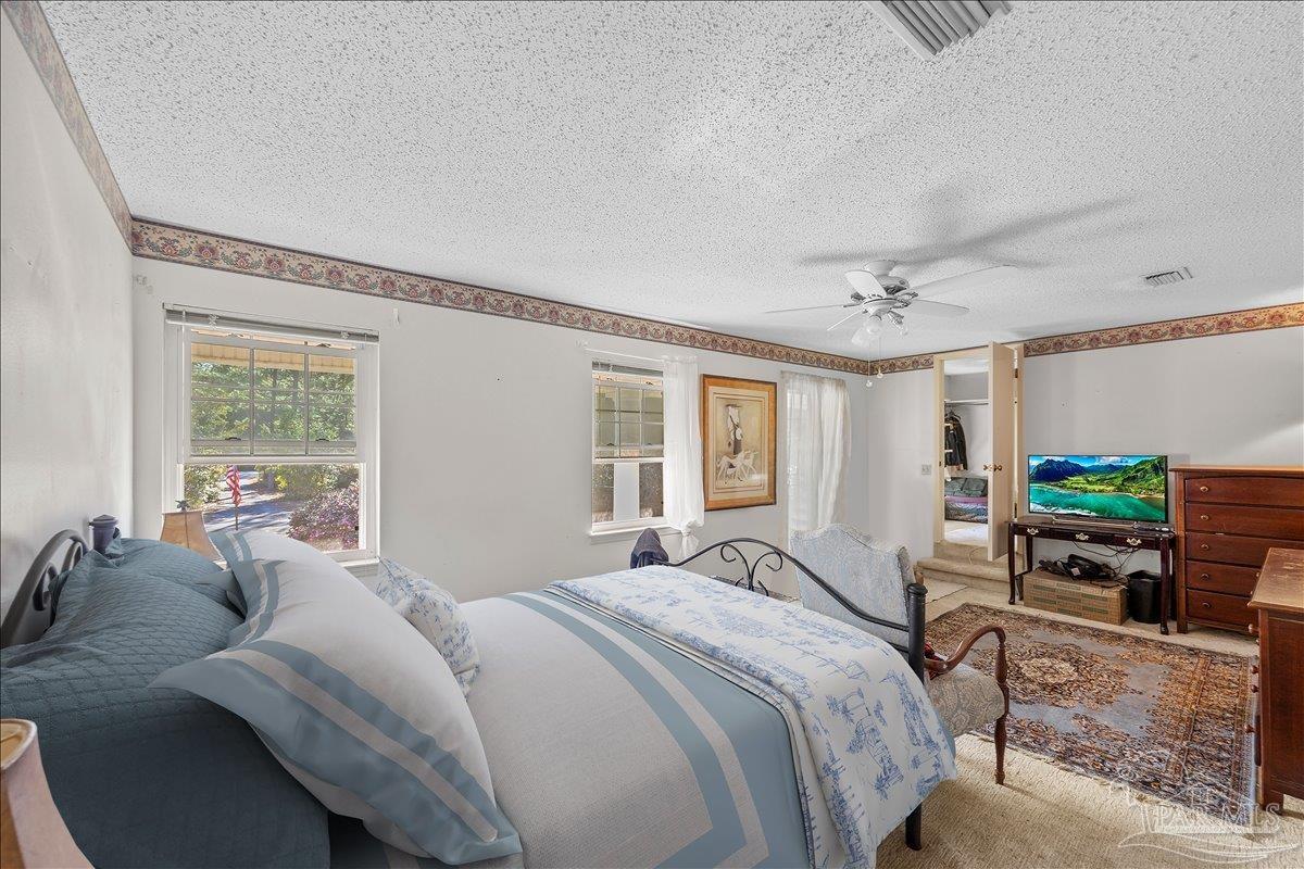 5560 Willard Norris Road Milton, FL 32570 - Photo 44 of 58 a bedroom with furniture and a window
