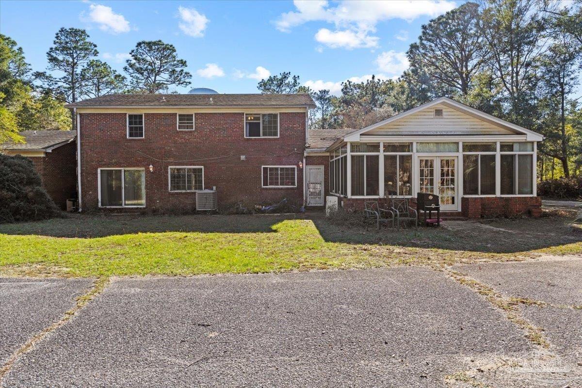 5560 Willard Norris Road Milton, FL 32570 - Photo 49 of 58 a front view of a house with a yard