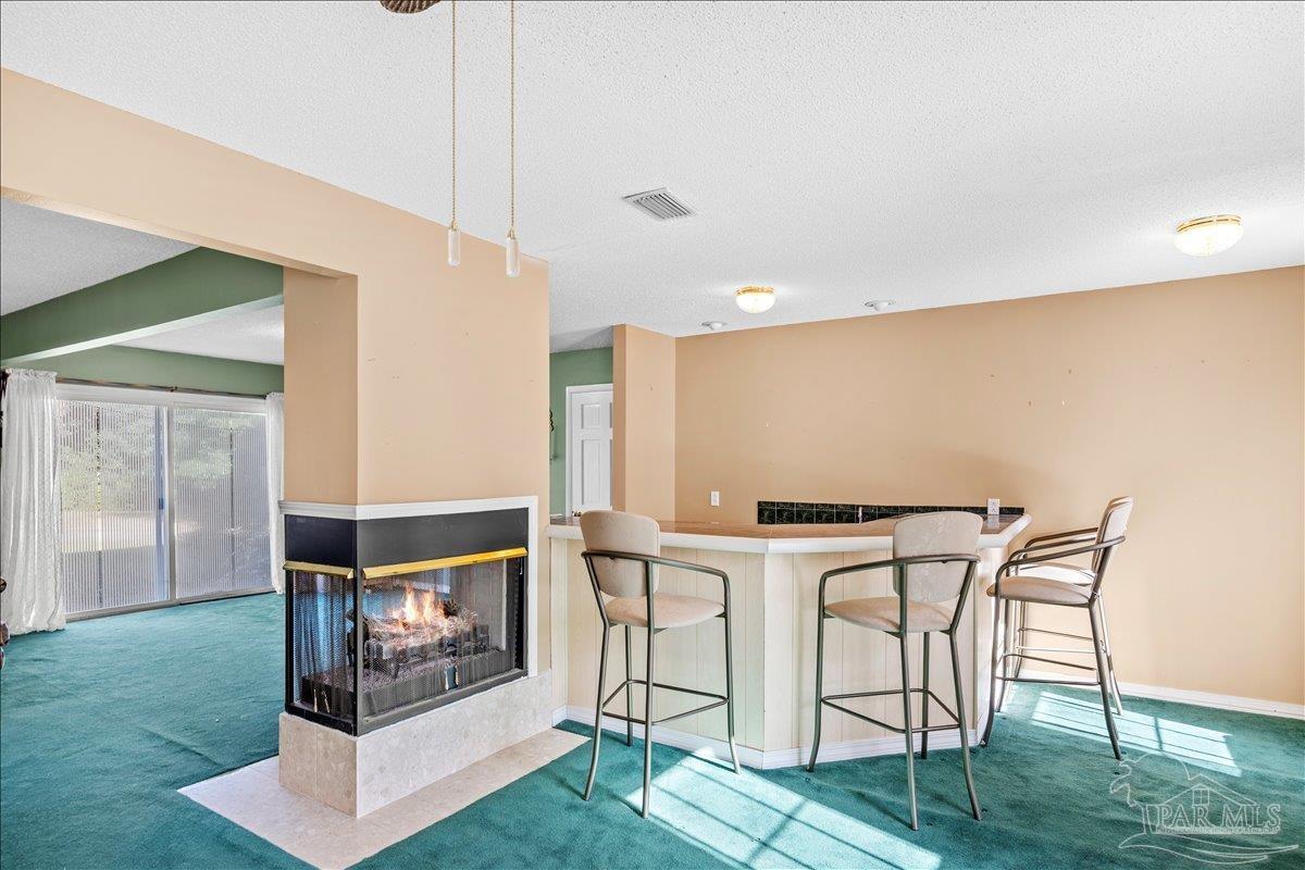 5560 Willard Norris Road Milton, FL 32570 - Photo 7 of 58 a view of kitchen with furniture and wooden floor