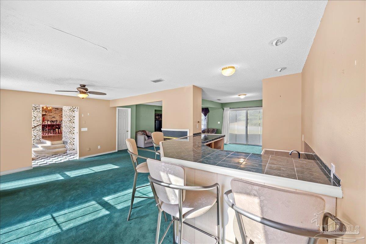 5560 Willard Norris Road Milton, FL 32570 - Photo 10 of 58 a dining room with furniture and window