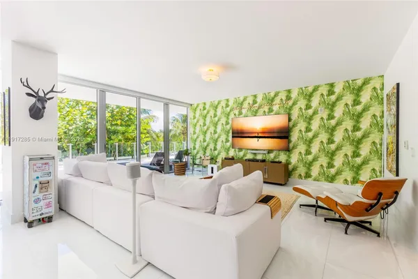 a living room with furniture and a flat screen tv