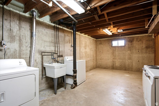 2252 West 800 North Clinton, UT 84015 - Photo 27 of 38 Lower-level utility area featuring exposed wood ceiling joists and concrete walls