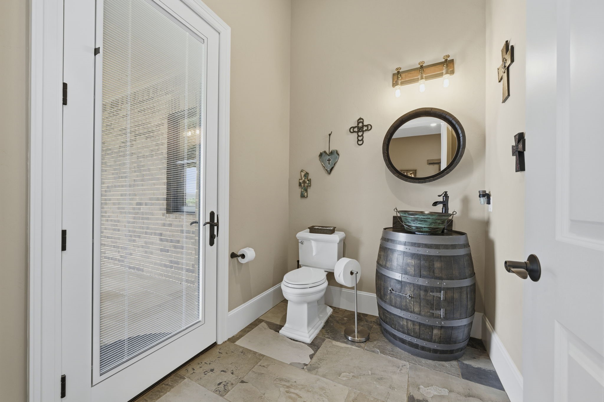 21620 Schiel Road Cypress, TX 77433 - Photo 17 of 49 A powder bath located just outside the media room also has an exterior door to make for easy access from the pool and outdoor living areas.