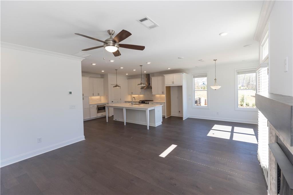 4912 Molder Avenue, Unit 66 Buford, GA 30518 - Photo 24 of 83 a view of an empty room with a window and a kitchen