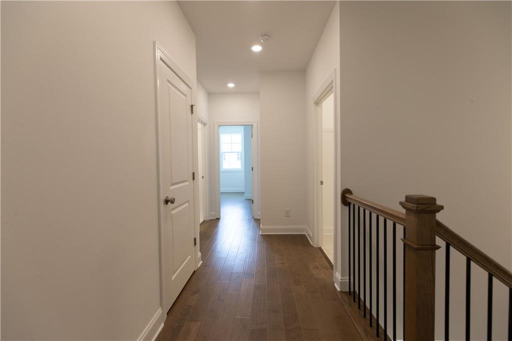 4912 Molder Avenue, Unit 66 Buford, GA 30518 - Photo 31 of 83 a view of a hallway with wooden floor