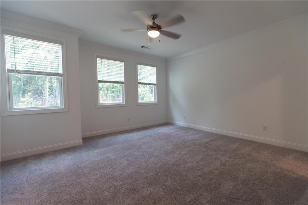 4912 Molder Avenue, Unit 66 Buford, GA 30518 - Photo 40 of 83 wooden floor in an empty room with a window