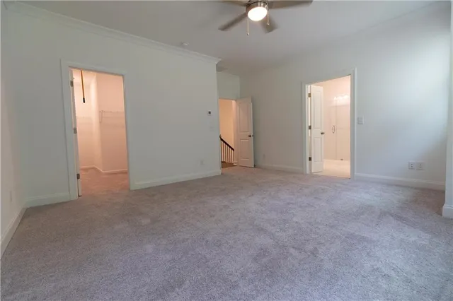 a view of a patio with couches table and chairs with wooden floor and fence
