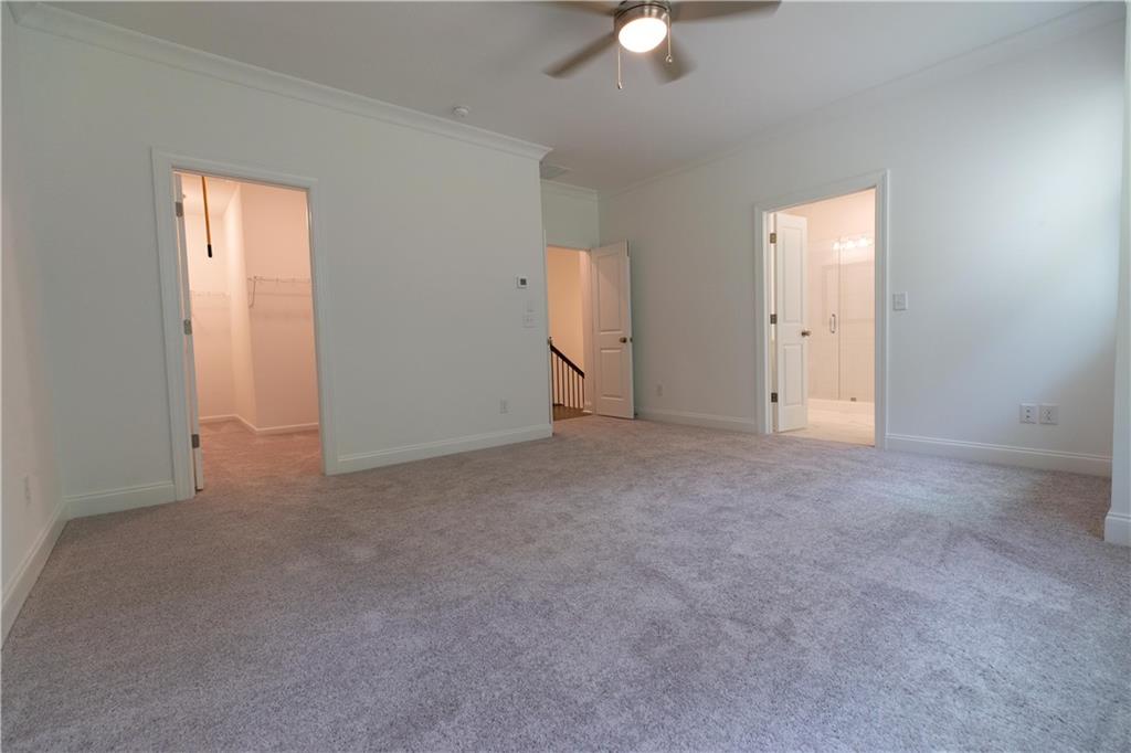 4912 Molder Avenue, Unit 66 Buford, GA 30518 - Photo 41 of 83 a view of an empty room with a window