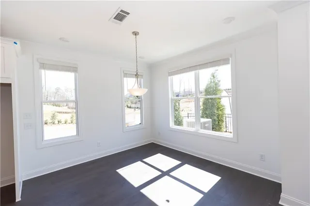a view of an entryway with wooden floor