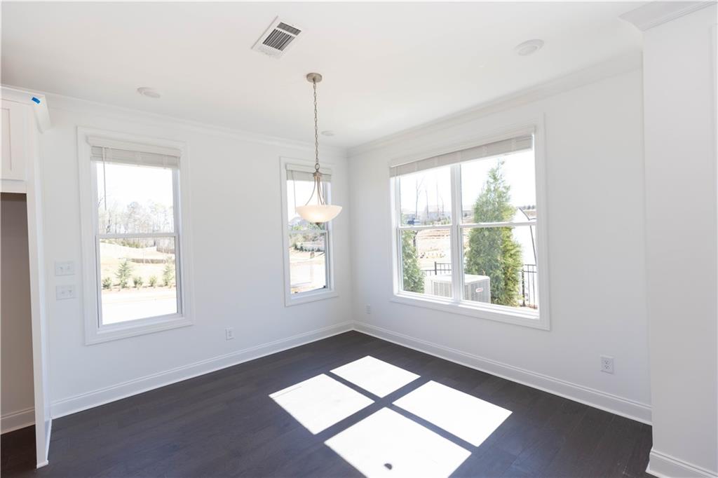 4912 Molder Avenue, Unit 66 Buford, GA 30518 - Photo 44 of 83 a view of an empty room with a window