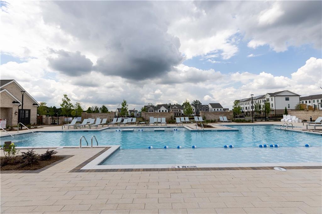 4912 Molder Avenue, Unit 66 Buford, GA 30518 - Photo 82 of 83 a view of swimming pool with outdoor seating