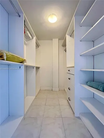 a bathroom with a tub and a shower