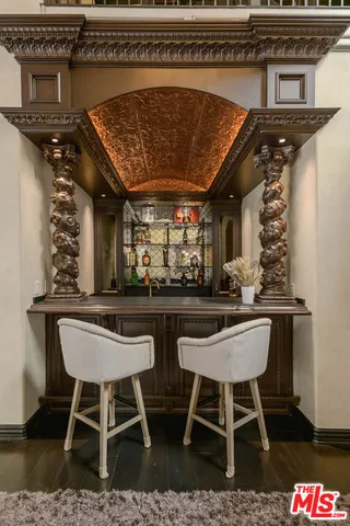 a view of a chairs and table in kitchen