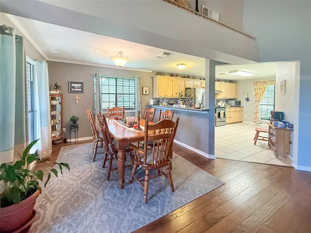 a view of a dining room with furniture window and wooden floor