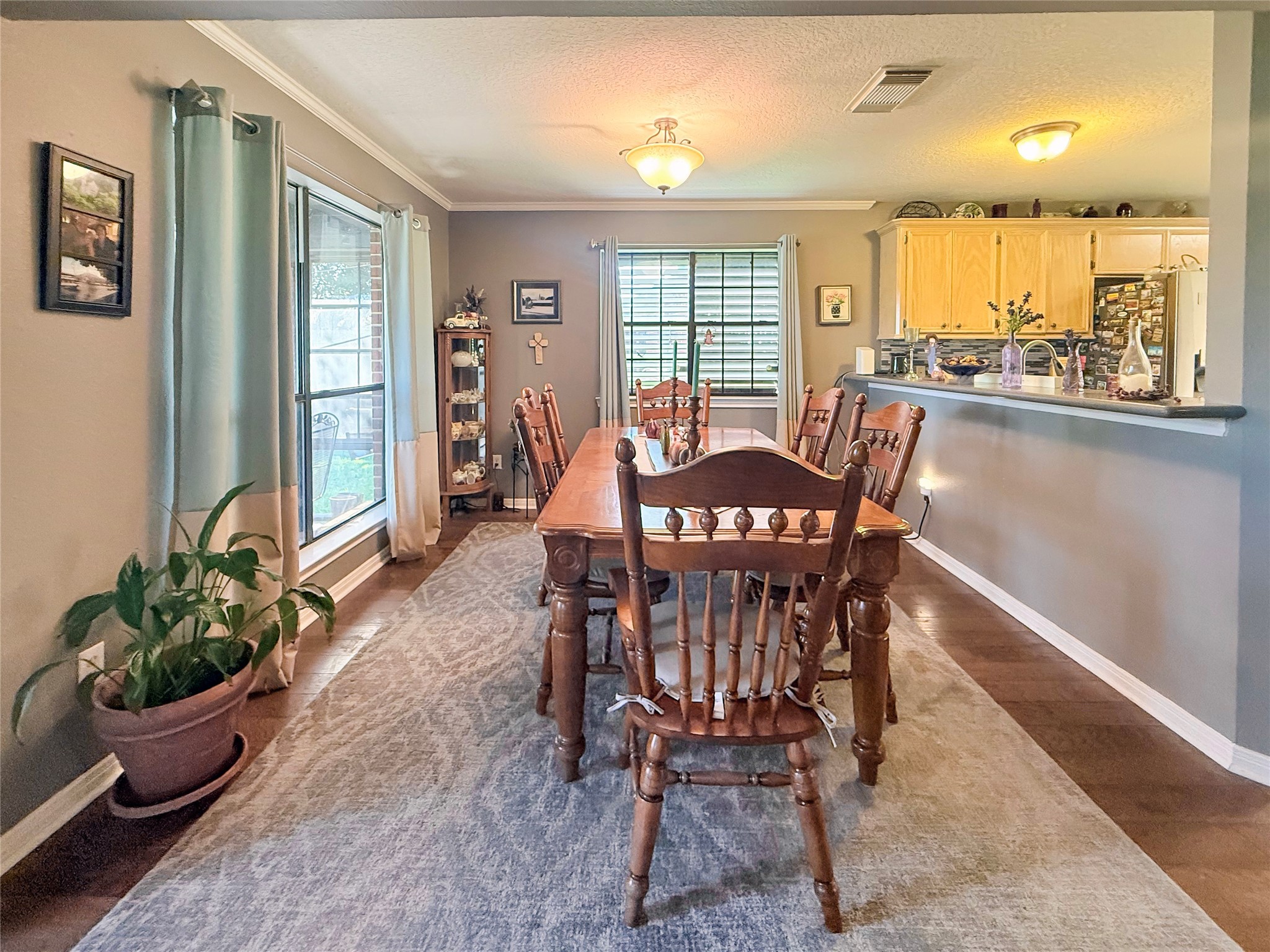 8 Rayburn Ridge Angleton, TX 77515 - Photo 12 of 22 a view of a dining room with furniture window and wooden floor
