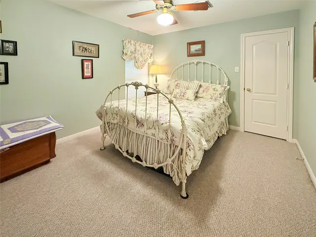a bed room with a bed and a chandelier