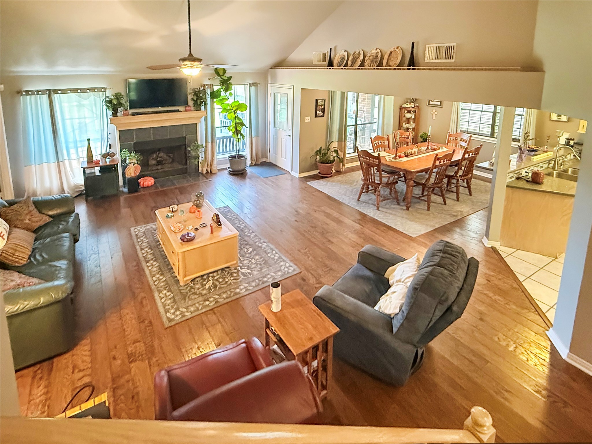8 Rayburn Ridge Angleton, TX 77515 - Photo 2 of 22 a living room with furniture fireplace and dining table