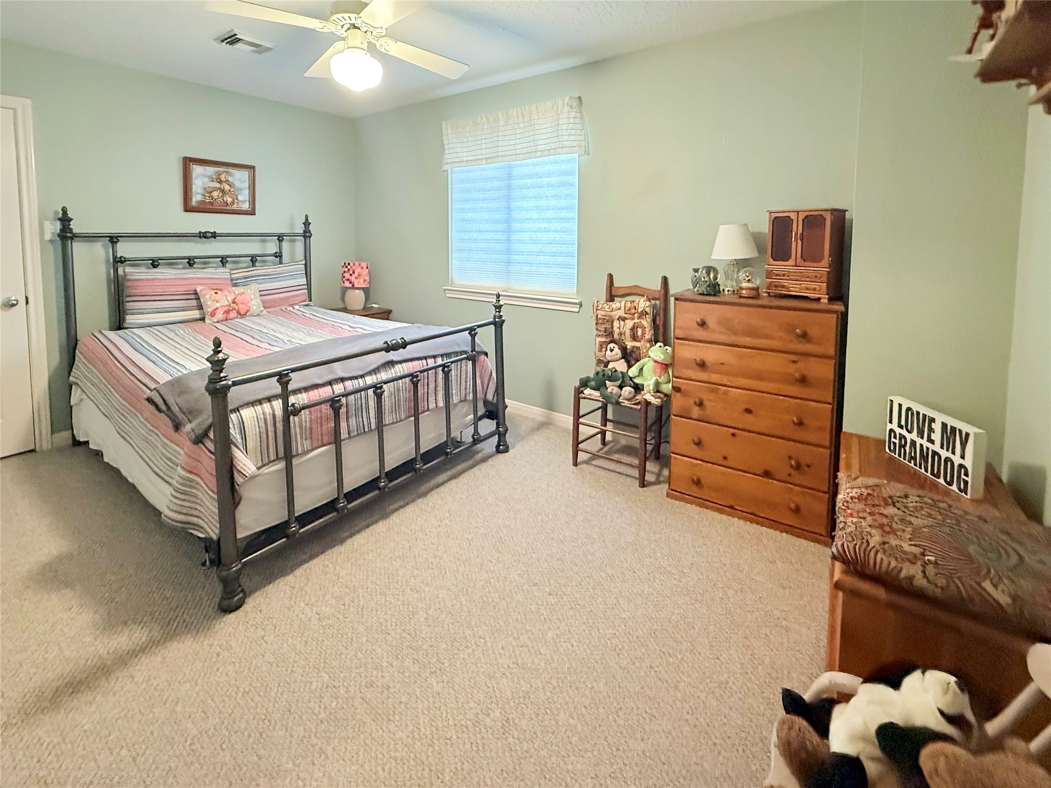 8 Rayburn Ridge Angleton, TX 77515 - Photo 21 of 22 a bedroom with furniture and a baby crib