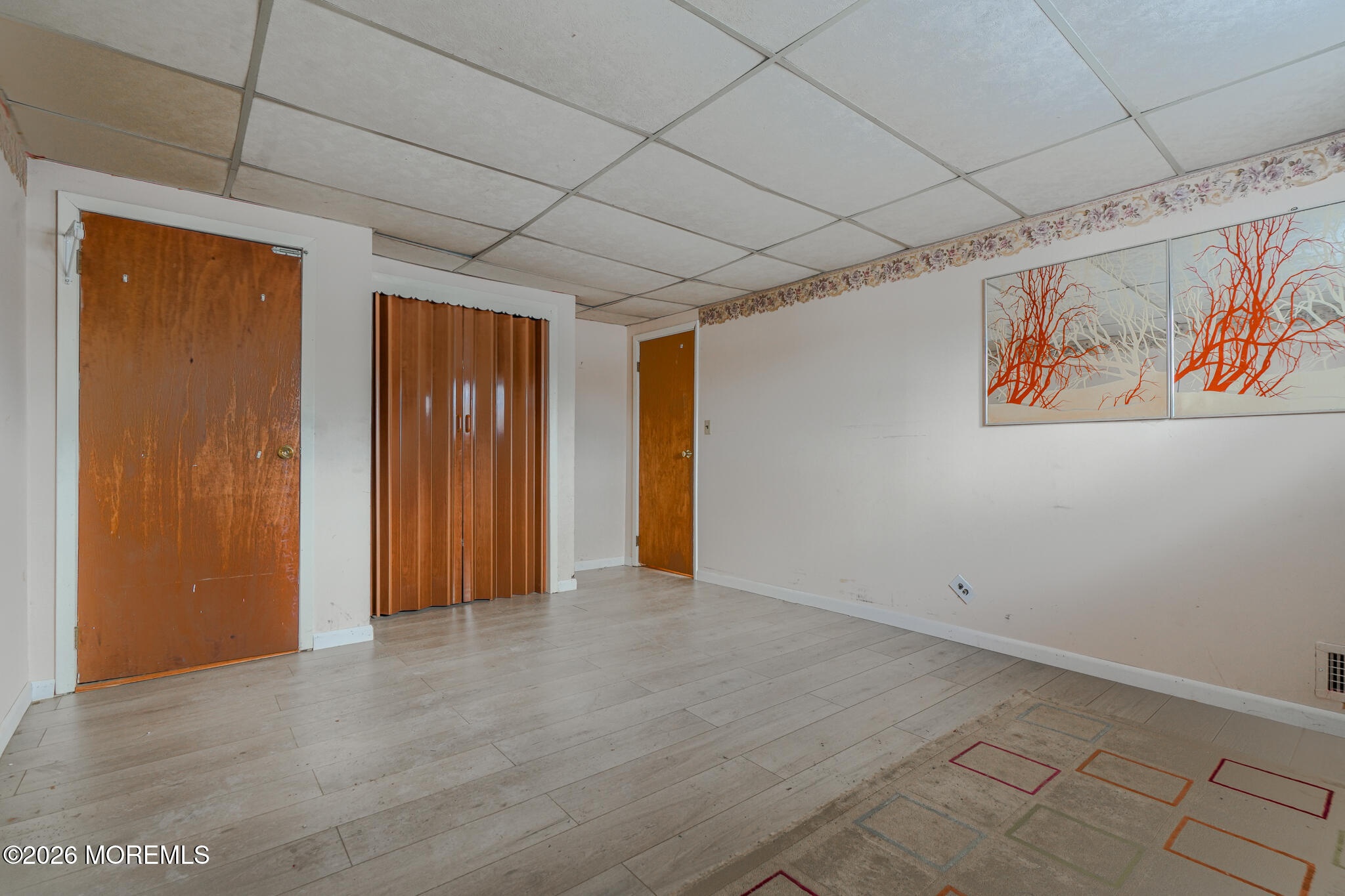 9 Hurley Street Keyport, NJ 07735 - Photo 13 of 22 a view of an empty room with a painting on the wall