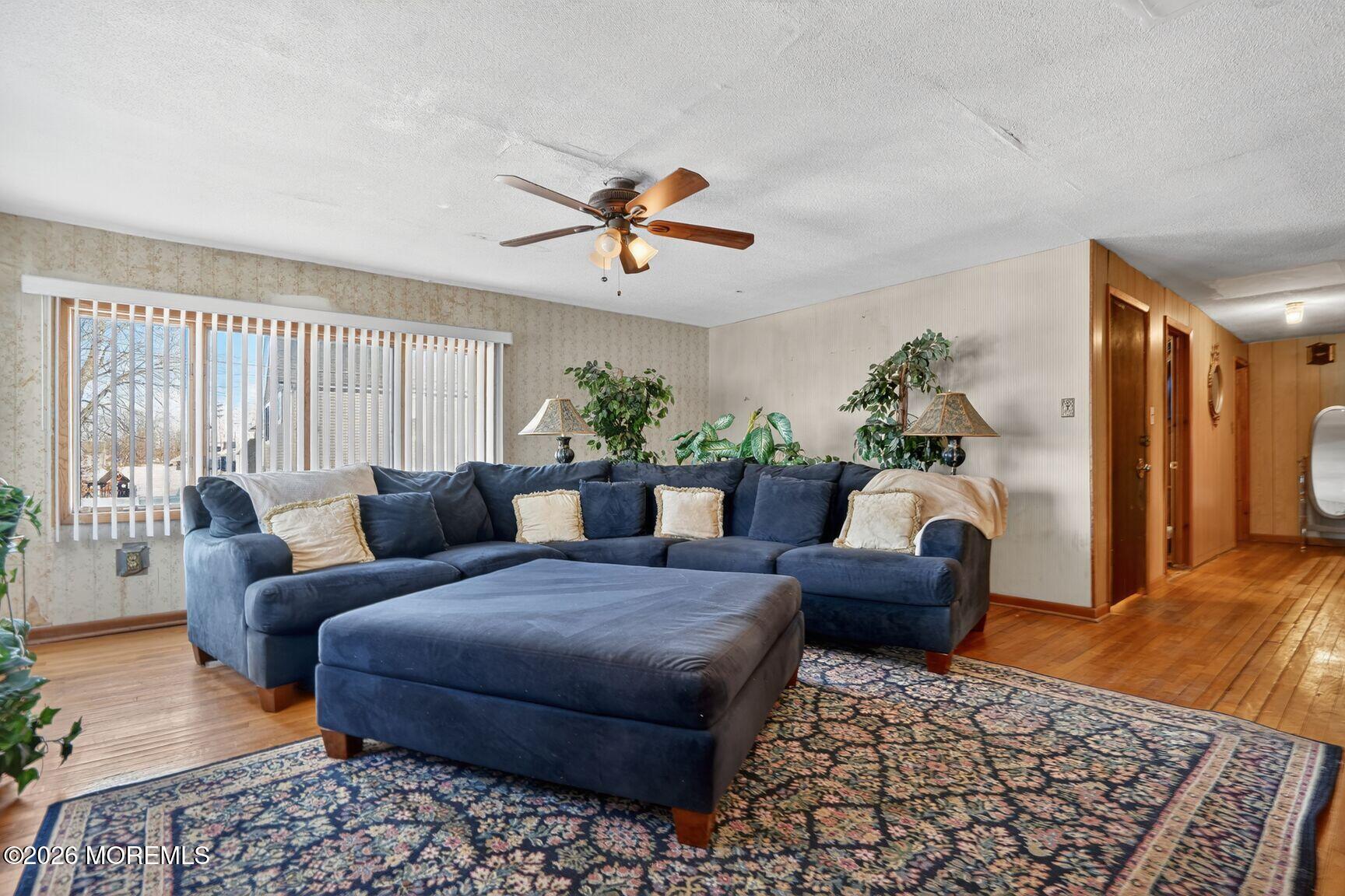 9 Hurley Street Keyport, NJ 07735 - Photo 17 of 22 a living room with furniture ceiling fan and a rug